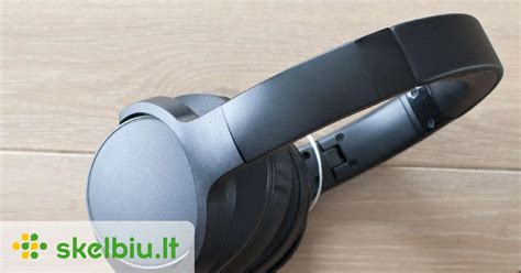 Žmogus, naudojantis Bluetooth ausines